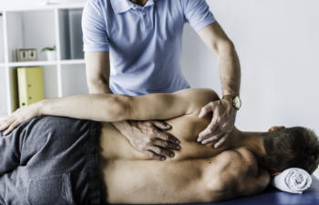 man undergoing chiropractic treatment