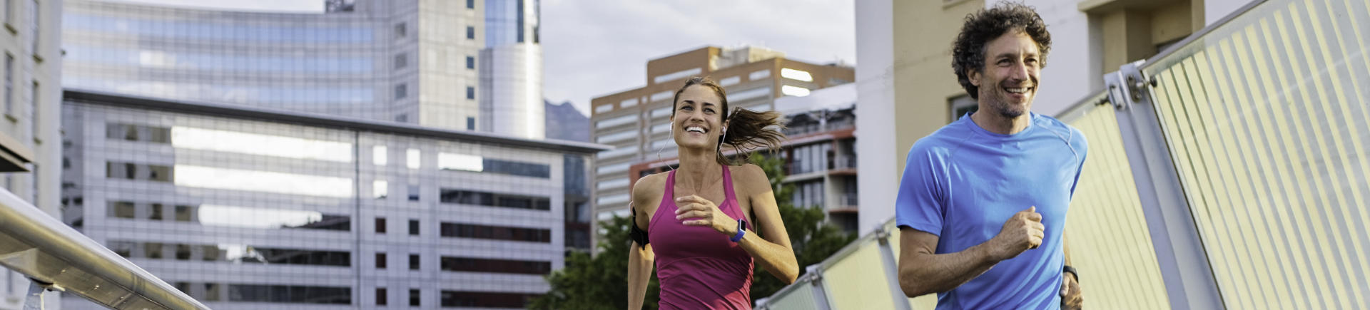 happy man and woman runners