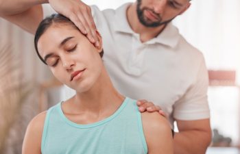 Physiotherapy, neck pain and stretching with woman and doctor for healthcare, chiropractic or consulting. Massage, wellness or medical with man and patient exam for rehabilitation, healing or therapy
